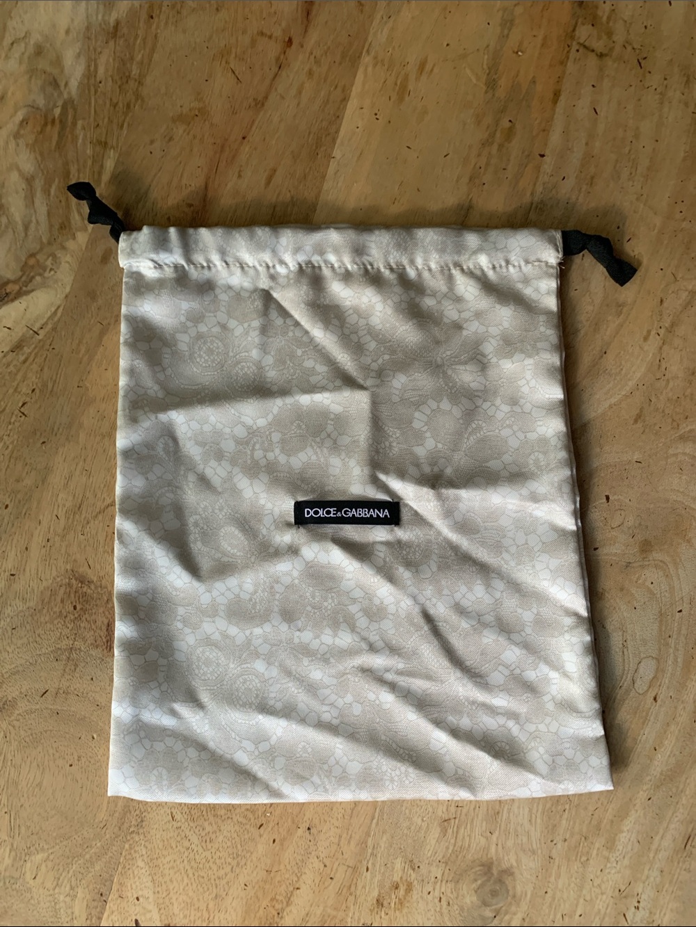 Dolce & Gabbana Cream Drawstring Pouch with Black Logo Tag